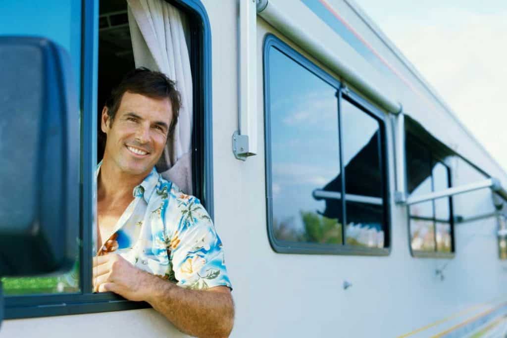 A man smiling in a caravan