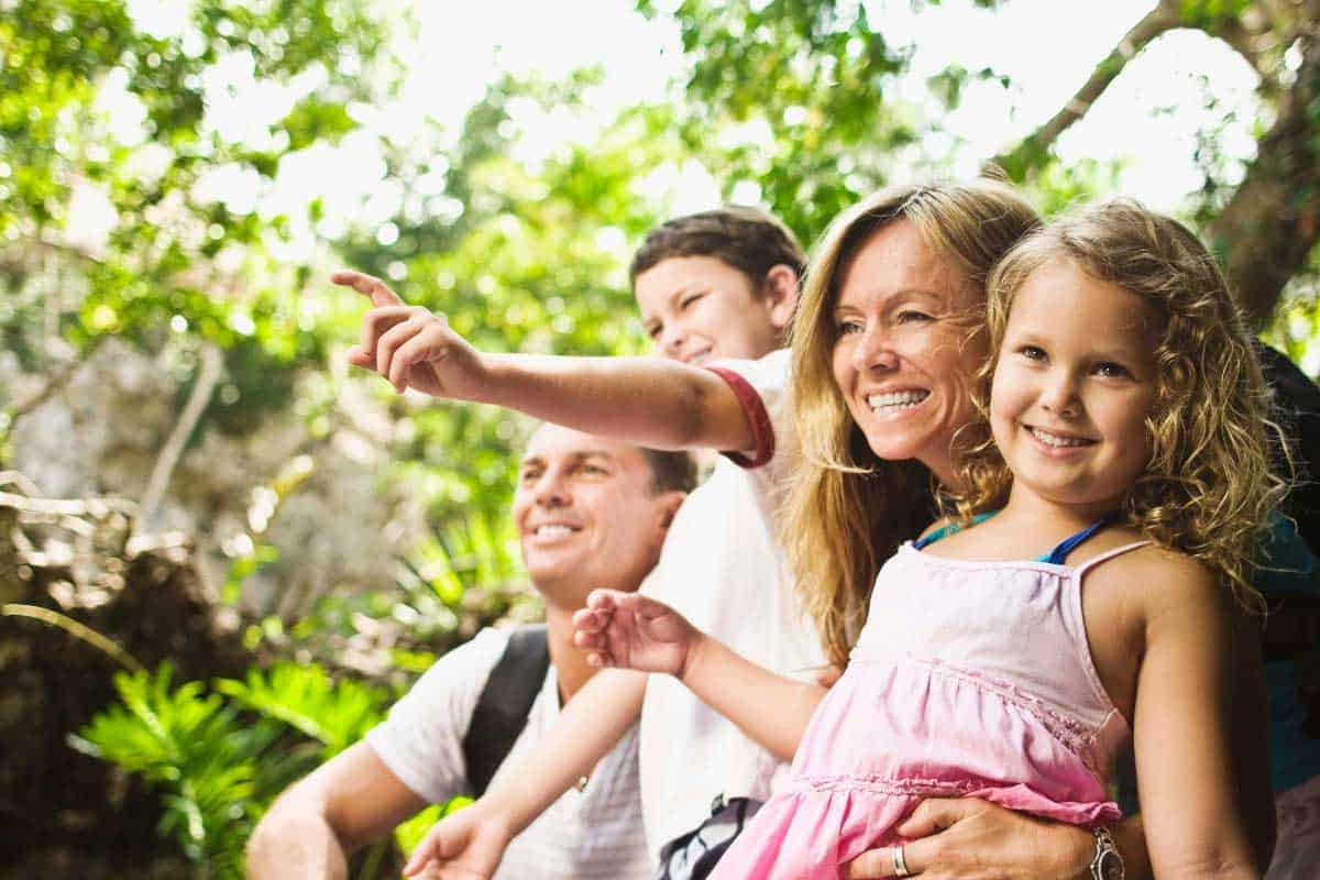 Family having fun at the forest and pointing