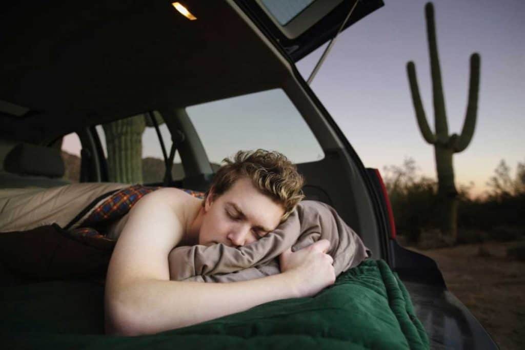 Man sleeping in an outback australian desert