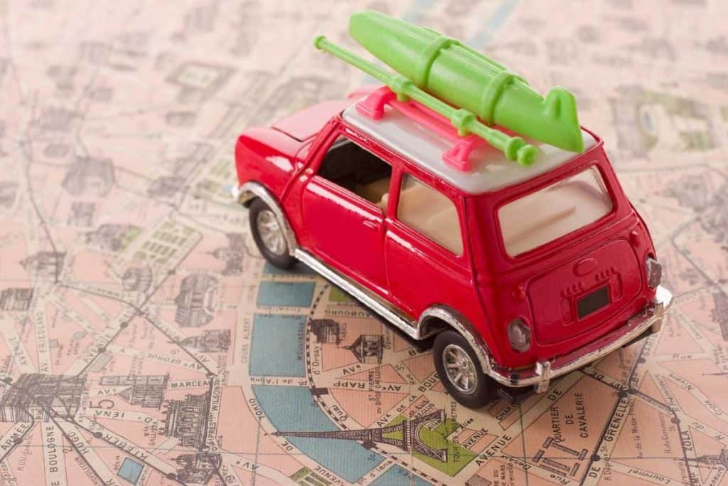 Toy car on map table for travel